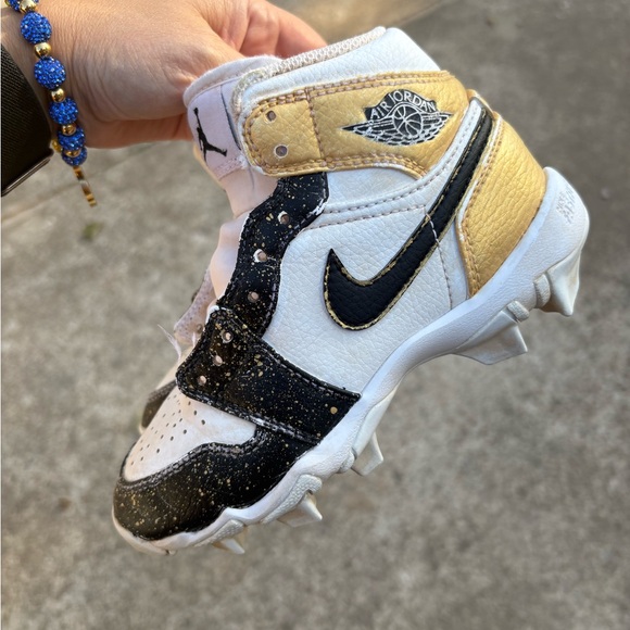 Nike Air Jordan Kids White, Black, and Gold Cleats - Picture 2 of 6